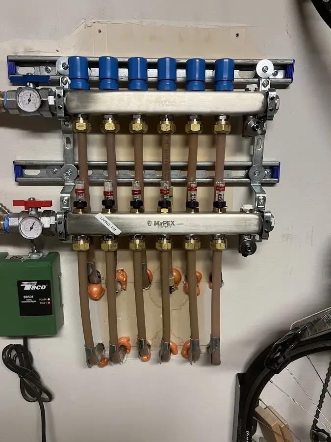 Plumber performing Water Heater Repair at a residential property in Clover Creek